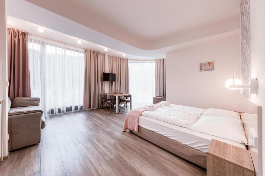 Postel nebo postele na pokoji v ubytování Kora Apartments
