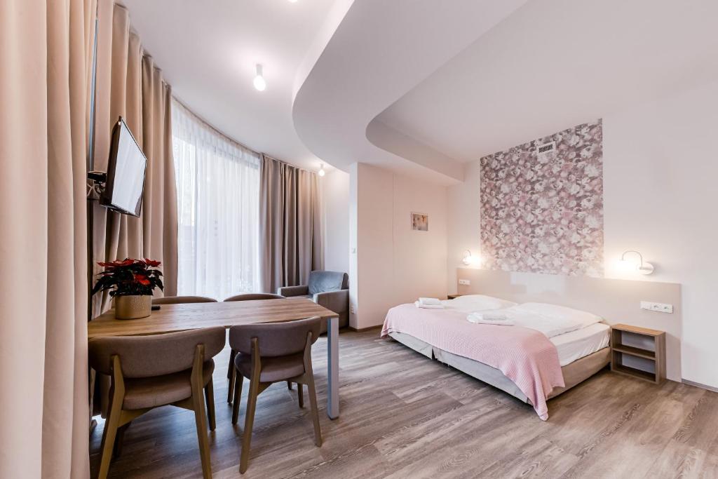 Postel nebo postele na pokoji v ubytování Kora Apartments