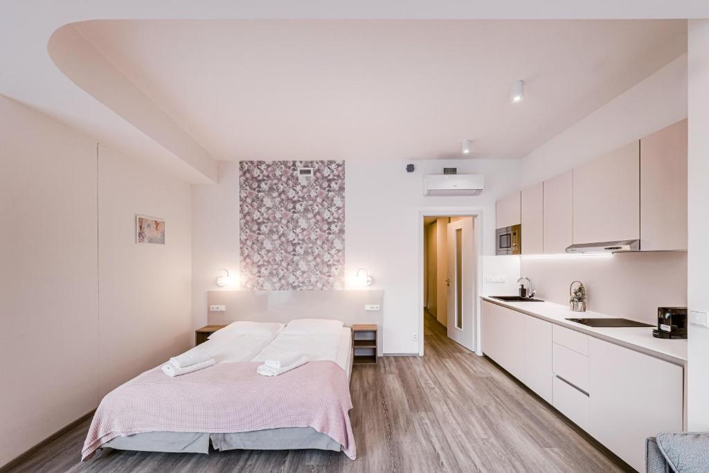 Postel nebo postele na pokoji v ubytování Kora Apartments