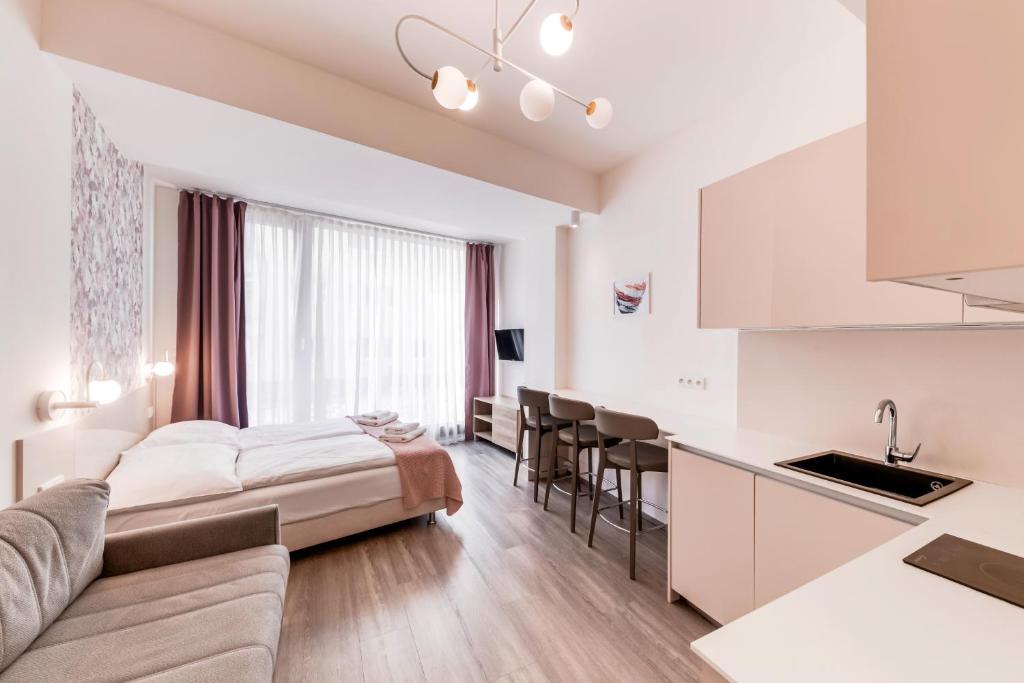 Postel nebo postele na pokoji v ubytování Kora Apartments