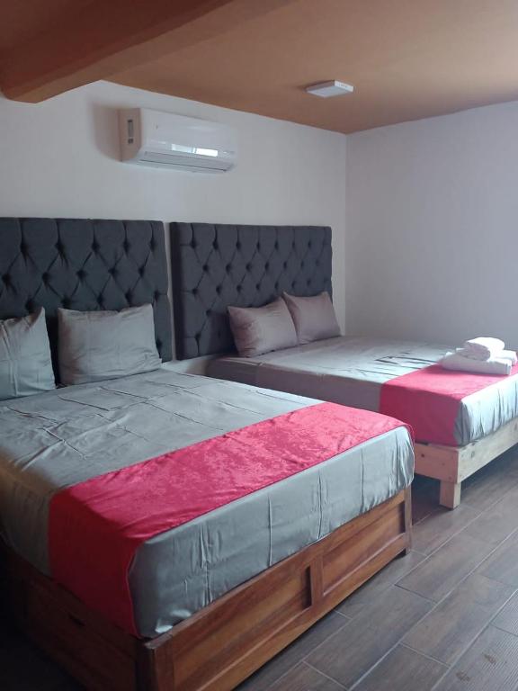 Postel nebo postele na pokoji v ubytování Hotel La Intimidad