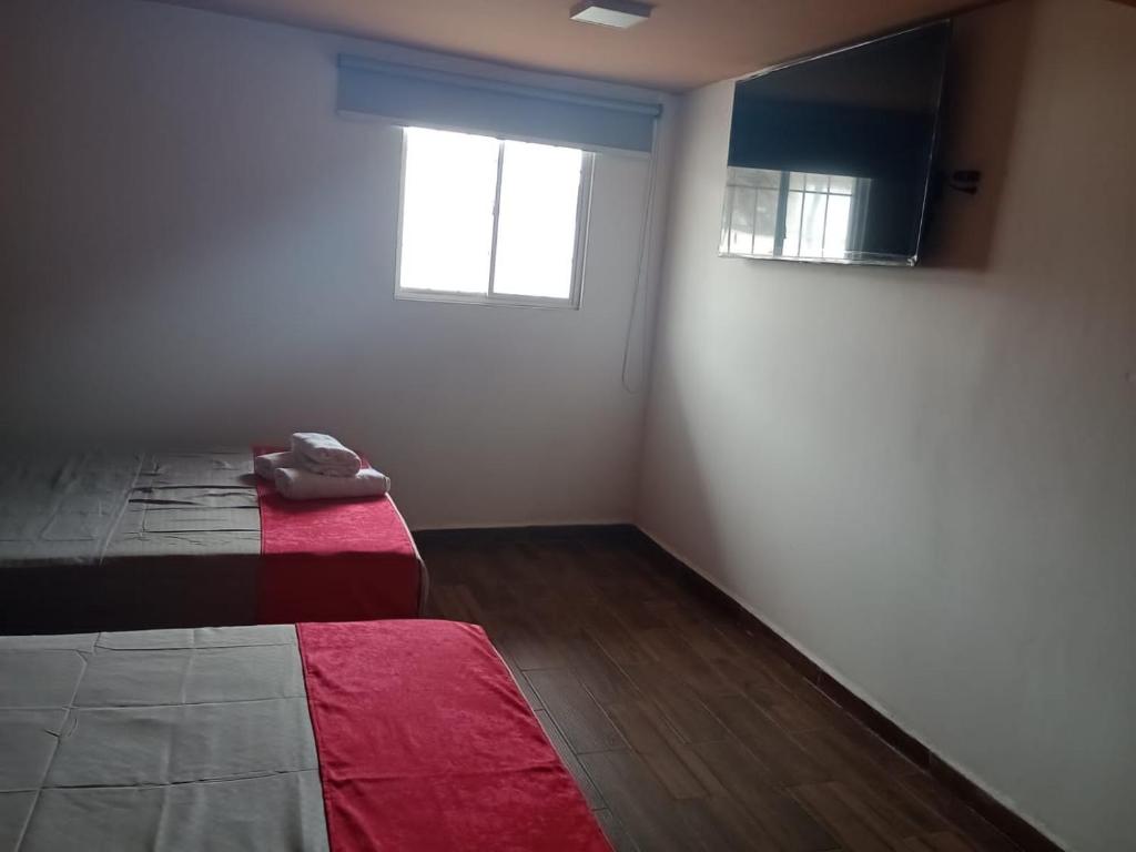 Postel nebo postele na pokoji v ubytování Hotel La Intimidad