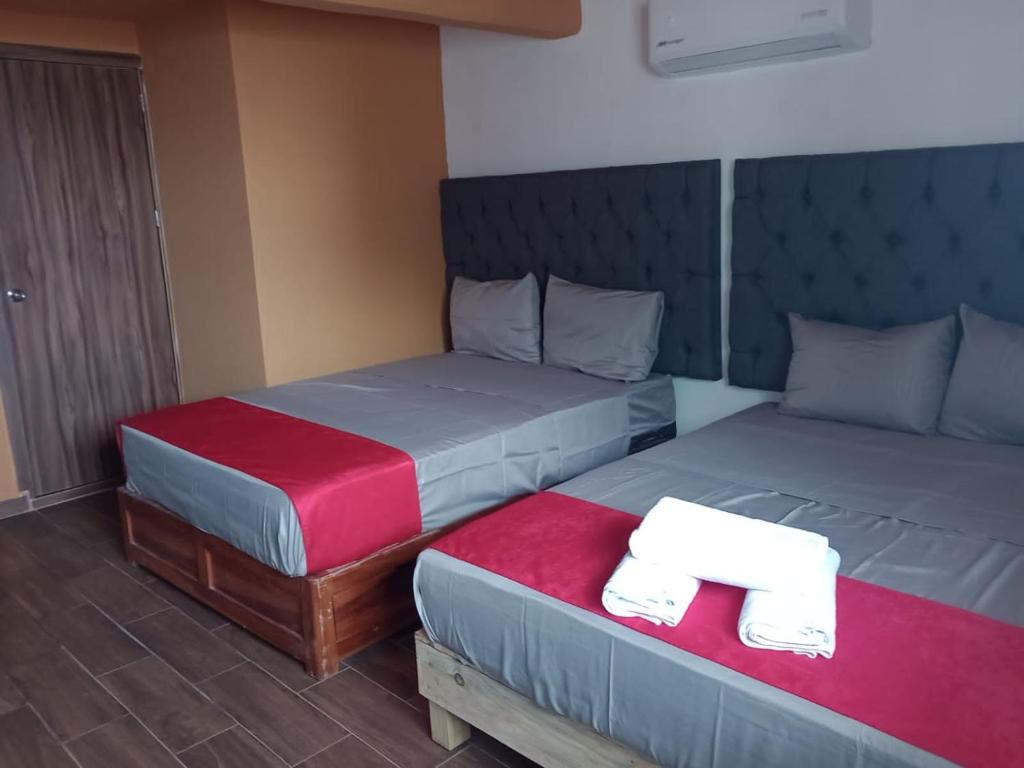 Postel nebo postele na pokoji v ubytování Hotel La Intimidad