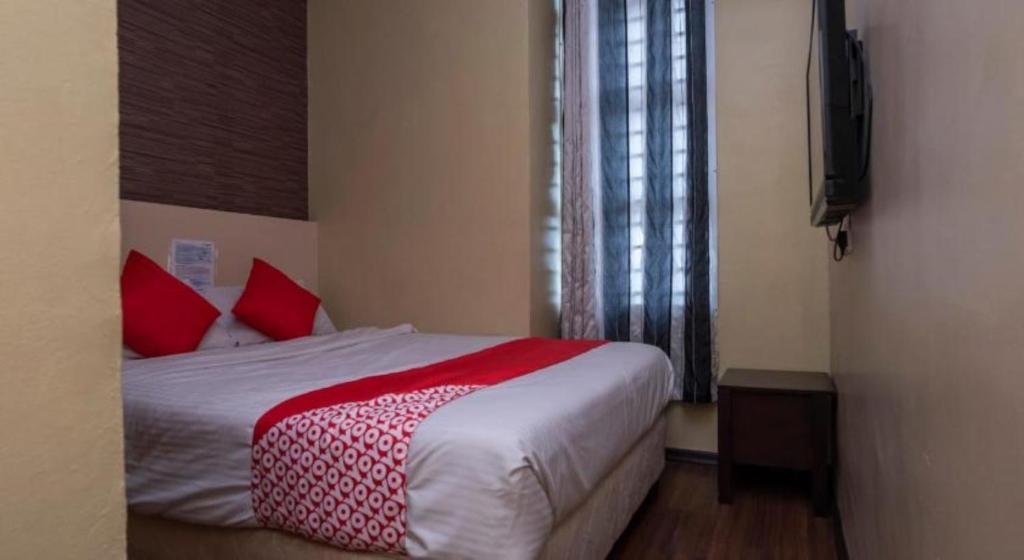 Postel nebo postele na pokoji v ubytování D'Pinetrees Hotel