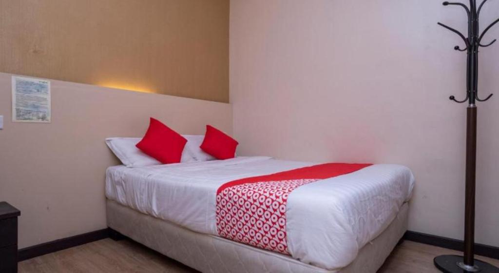 Postel nebo postele na pokoji v ubytování D'Pinetrees Hotel