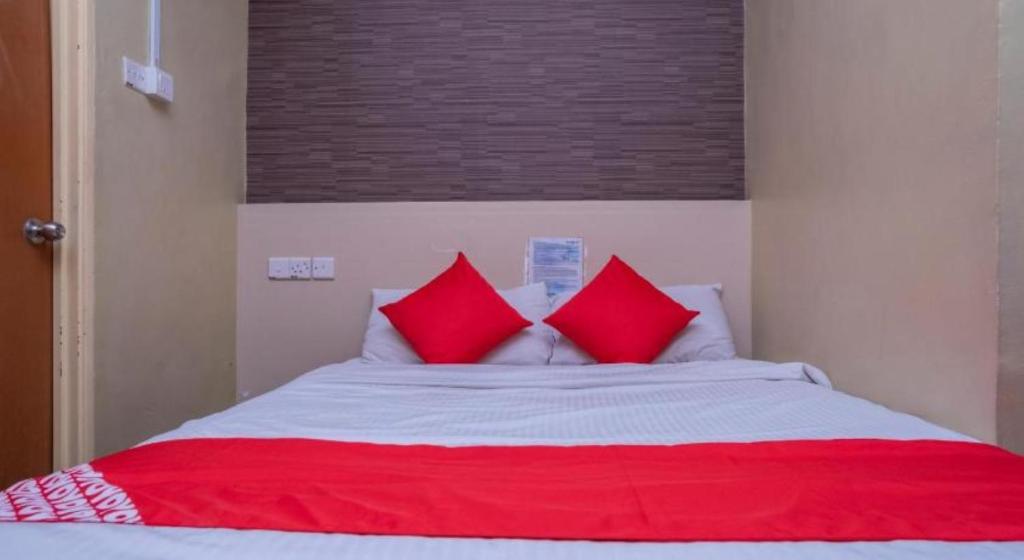 Postel nebo postele na pokoji v ubytování D'Pinetrees Hotel
