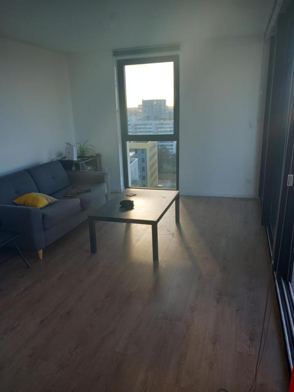 Część wypoczynkowa w obiekcie Appartement standing Vue panoramique sur Nantes