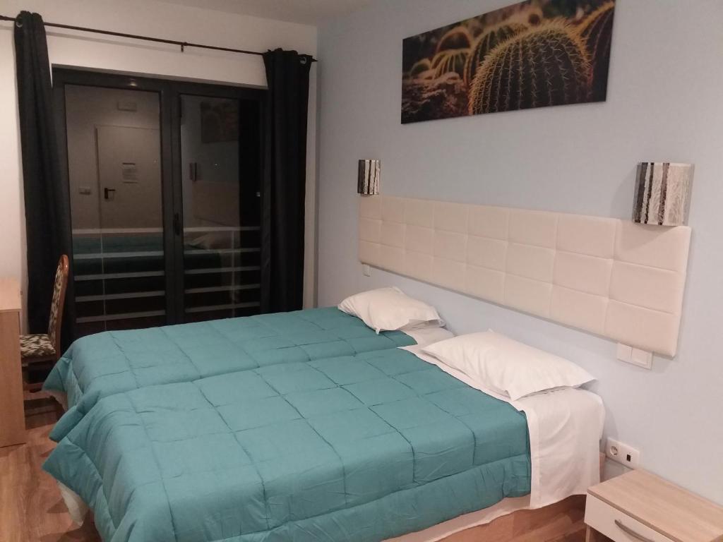 Postel nebo postele na pokoji v ubytování LPA PEREIRA Hotel restaurante