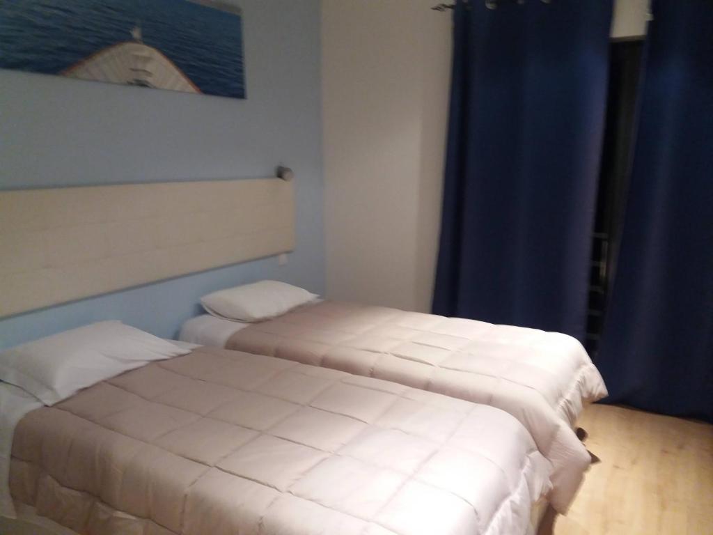 Postel nebo postele na pokoji v ubytování LPA PEREIRA Hotel restaurante
