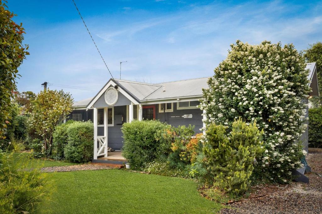 a house with a garden in front of it at Bayview Cottage in Ventnor