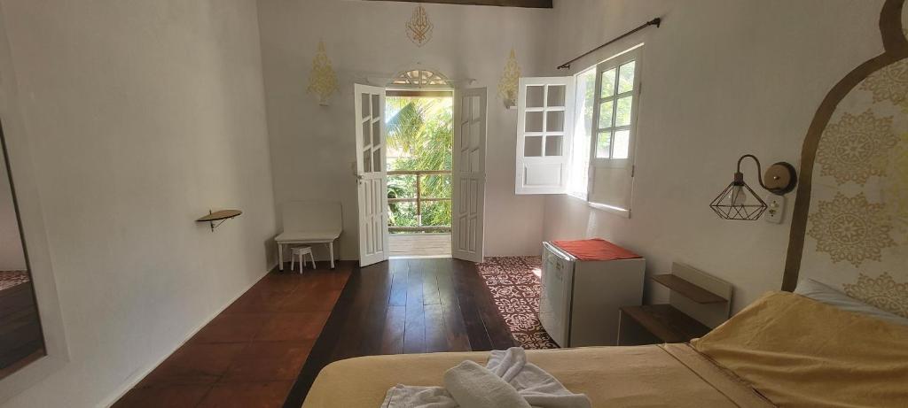 Postel nebo postele na pokoji v ubytování Imbassaí Pousada Hostel Lujimba