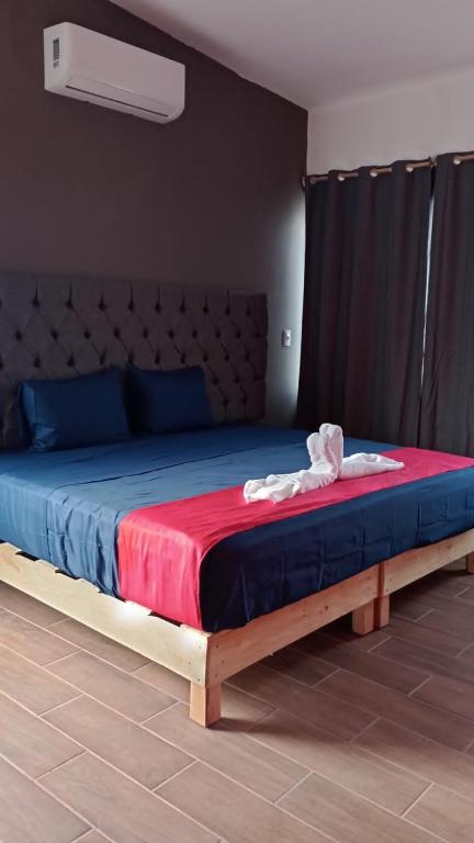 Postel nebo postele na pokoji v ubytování Hotel La Intimidad