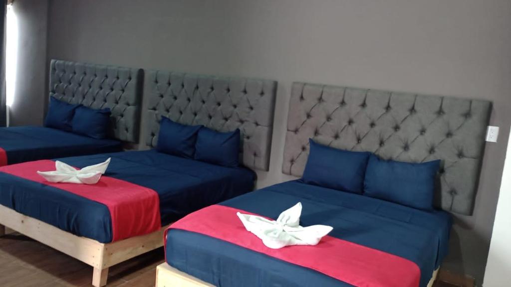 Postel nebo postele na pokoji v ubytování Hotel La Intimidad