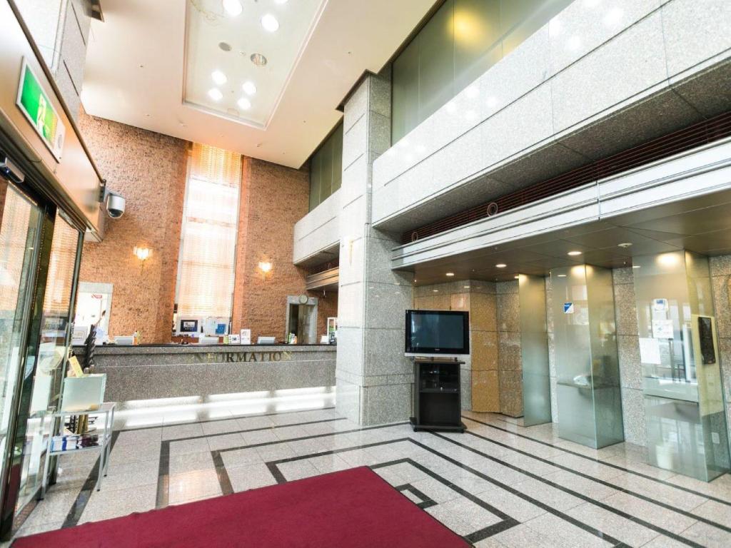 TV a/nebo společenská místnost v ubytování U-Community Hotel