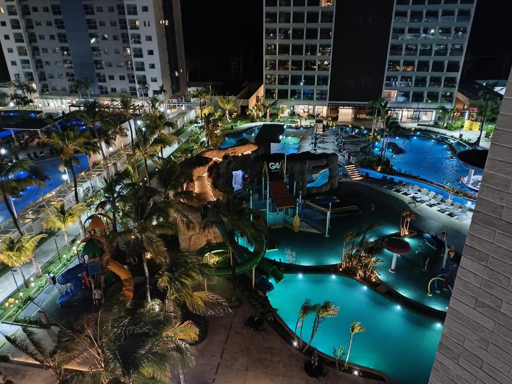 an aerial view of a resort pool at night at Salinas Premium Resort in Salinópolis