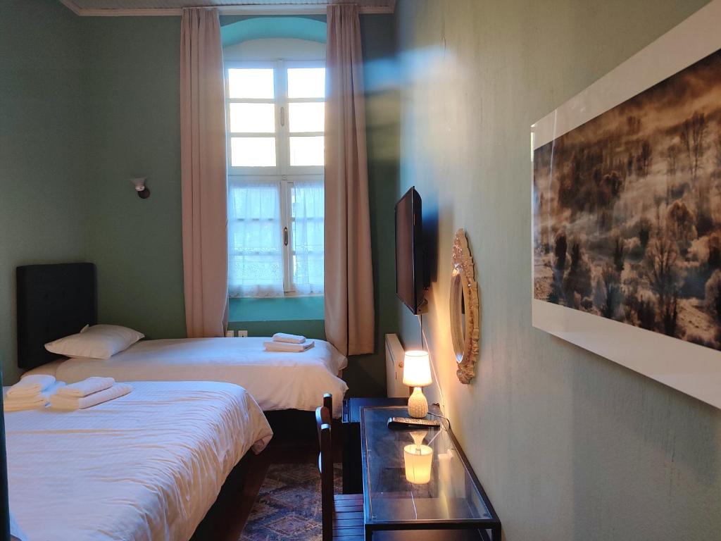 Voodi või voodid majutusasutuse The Old School Boutique Hotel toas