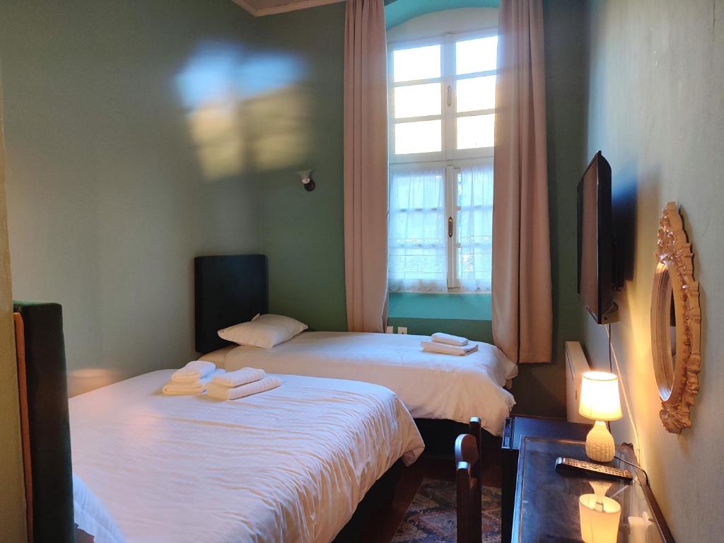 Voodi või voodid majutusasutuse The Old School Boutique Hotel toas