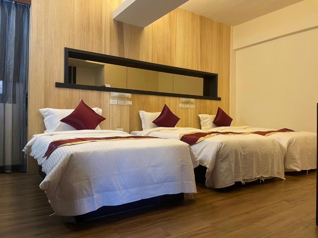 Postel nebo postele na pokoji v ubytování Zhao Lai Hotel