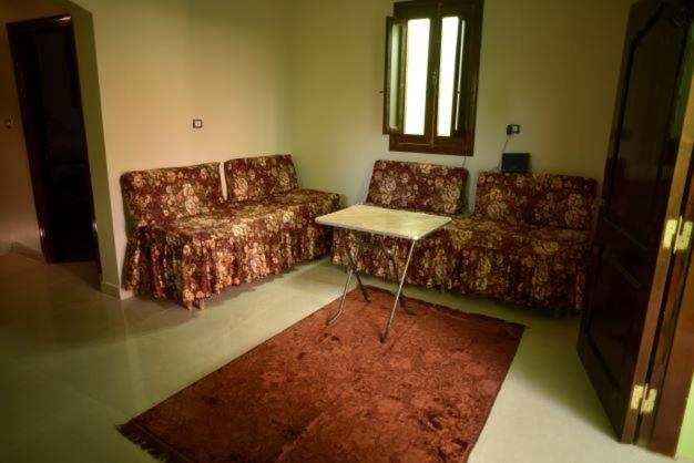 Ein Sitzbereich in der Unterkunft Nubian Queen Guest House