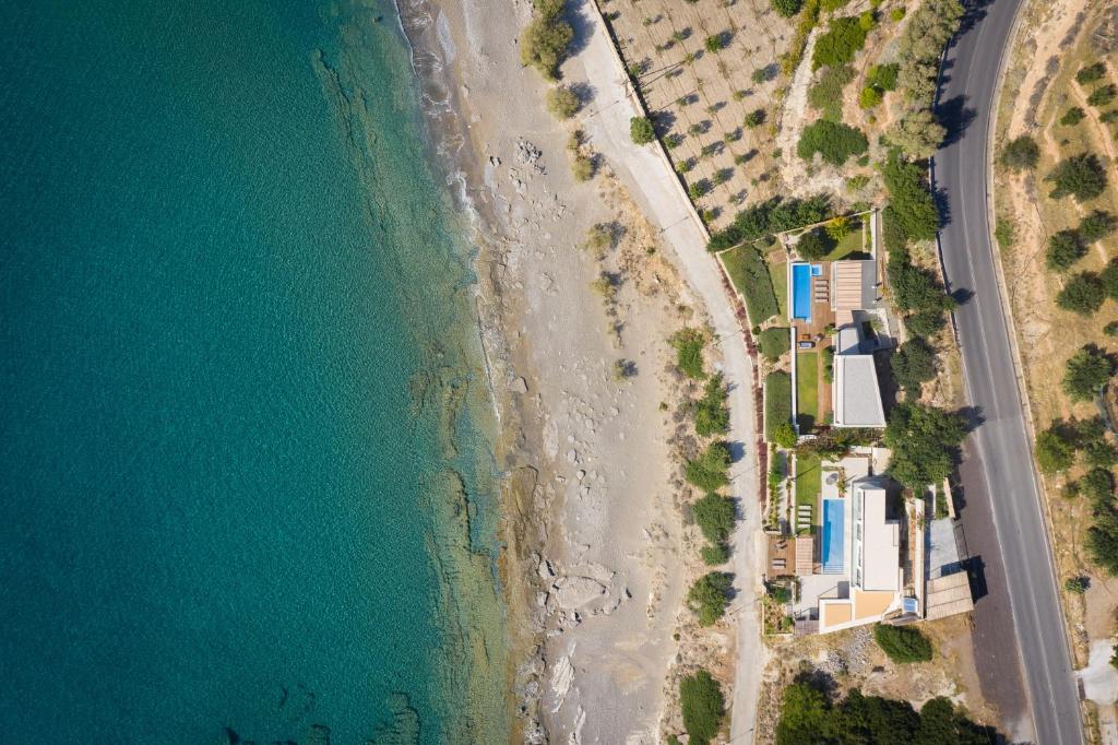 an overhead view of the beach and ocean at Villa Thalassa in Ferma