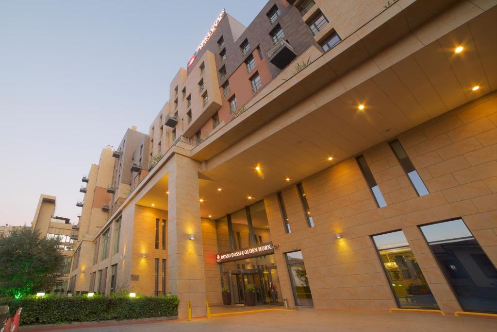 a large building with lights on the side of it at Dosso Dossi Hotels & SPA Golden Horn in Istanbul