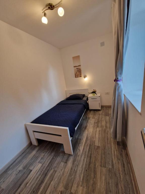 Postel nebo postele na pokoji v ubytování Lavanda apartman 1