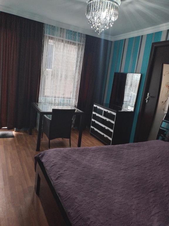 Postel nebo postele na pokoji v ubytování Bagrationi 54