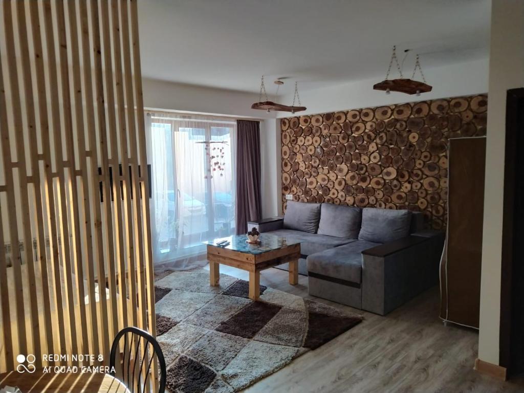 a living room with a couch and a table at ГудиВуди in Tsaghkadzor