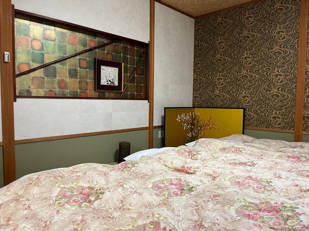 Postel nebo postele na pokoji v ubytování Kyoto Ryokan Gion Sano