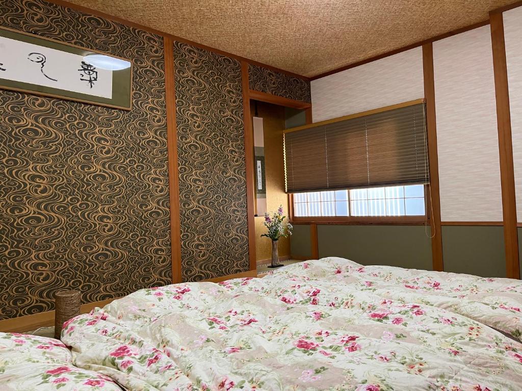 Postel nebo postele na pokoji v ubytování Kyoto Ryokan Gion Sano