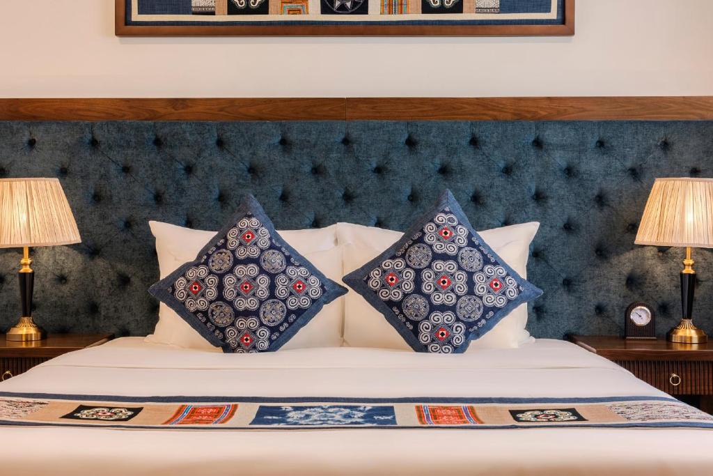 Postel nebo postele na pokoji v ubytování Balcona Hotel Da Nang