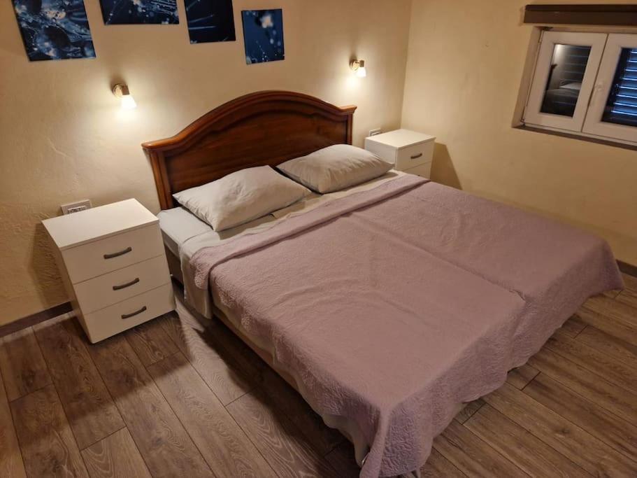 Postel nebo postele na pokoji v ubytování Lavanda apartman 2
