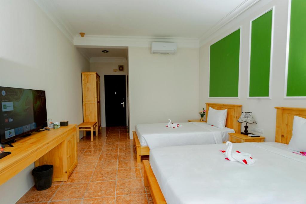 Postel nebo postele na pokoji v ubytování Sea and Sand Hotel