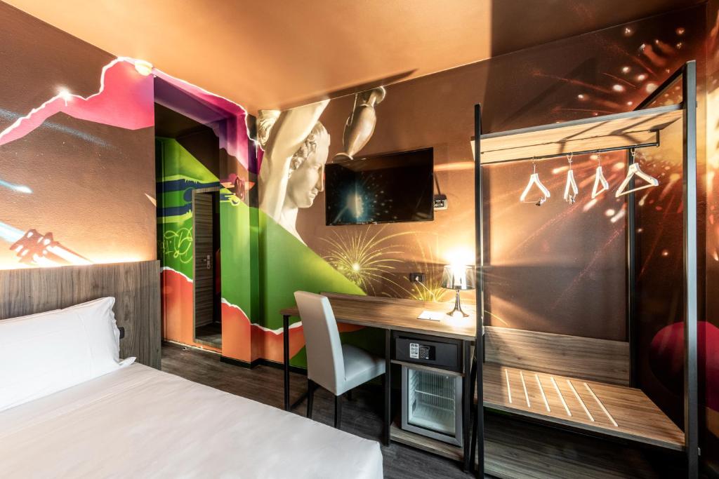 TV a/nebo společenská místnost v ubytování Muraless Art Hotel - WorldHotels Crafted