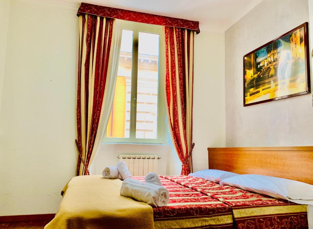 Postel nebo postele na pokoji v ubytování Toffa Place In Rome