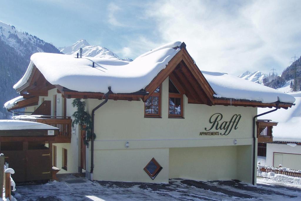 a snow covered roof of a building with snow on it at RAFFL APART in Sankt Anton am Arlberg