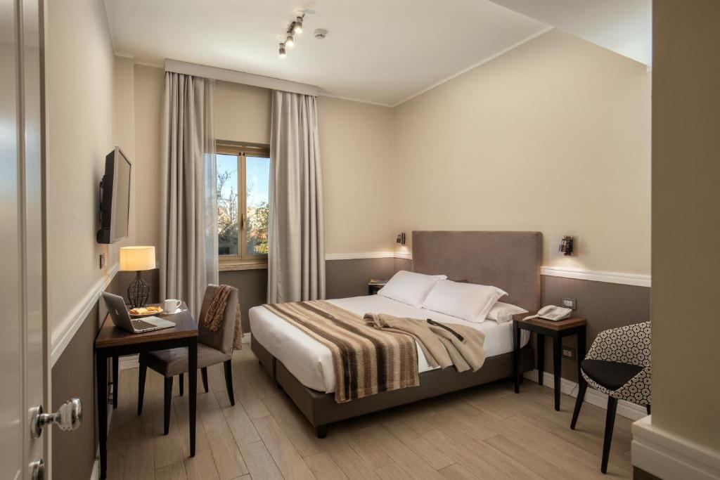 A bed or beds in a room at Fragrance Hotel St. Peter