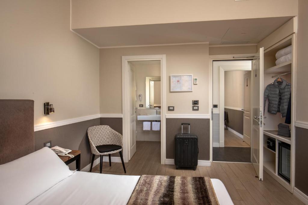 A bed or beds in a room at Fragrance Hotel St. Peter
