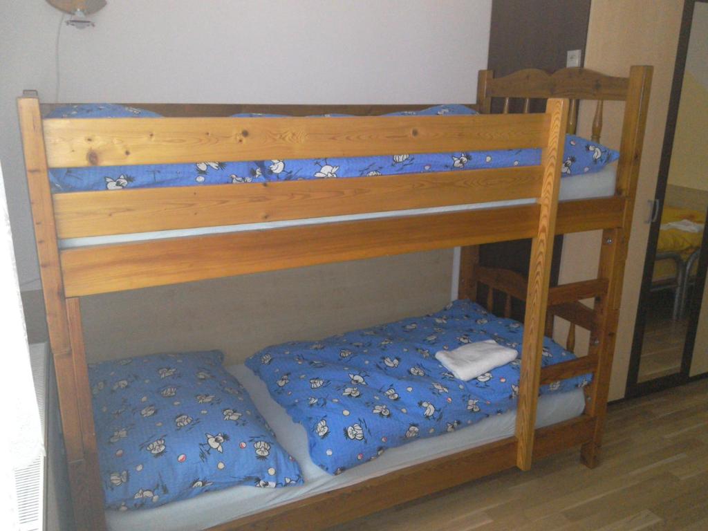 Łóżko lub łóżka w pokoju w obiekcie Apartmány pod Suchým Vrchem