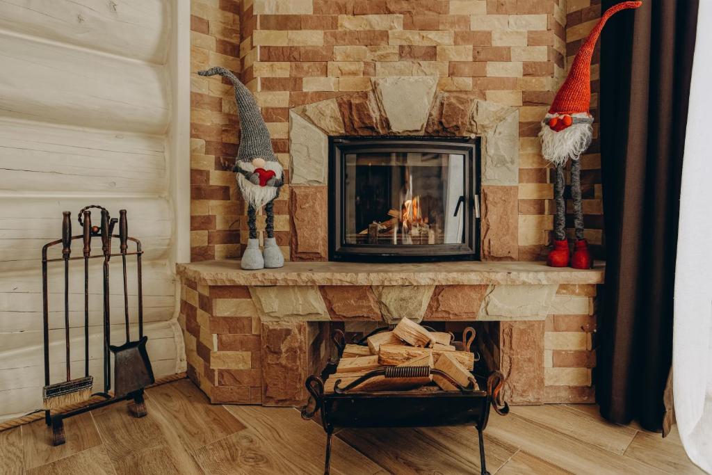 a living room with a fireplace with santa hats at Wonder in Palyanytsya