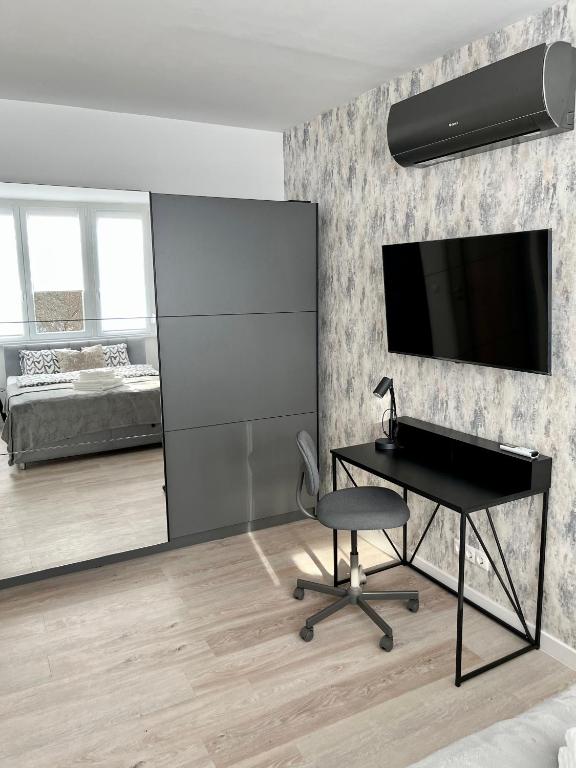 TV a/nebo společenská místnost v ubytování Millennium Apartman Tatabánya