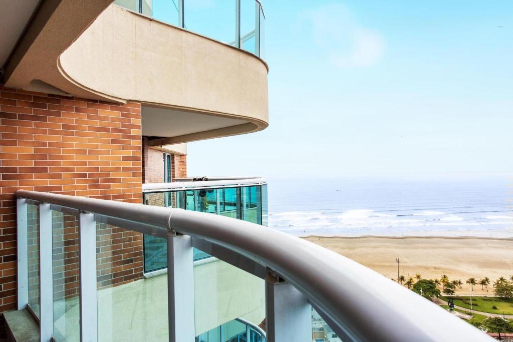 a balcony of a building with a view of the ocean at Estanconfor Santos com Vista Mar 2 in Santos