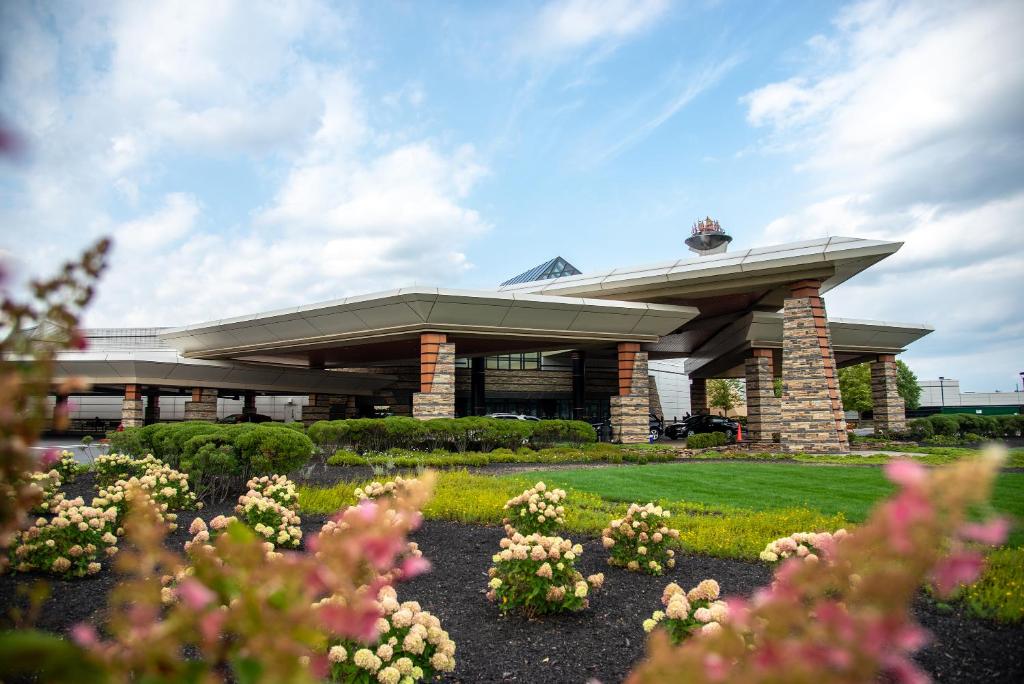 a building with a bunch of flowers in front of it at Mohegan Pennsylvania - Adults Only in Wilkes-Barre