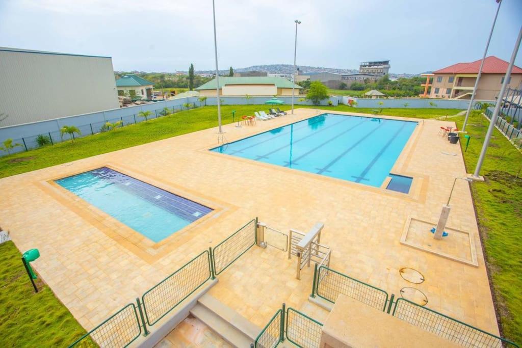 an overhead view of a large swimming pool at 3 bdrm Cityview Apt with Pool, Gym & Children Playground in Accra