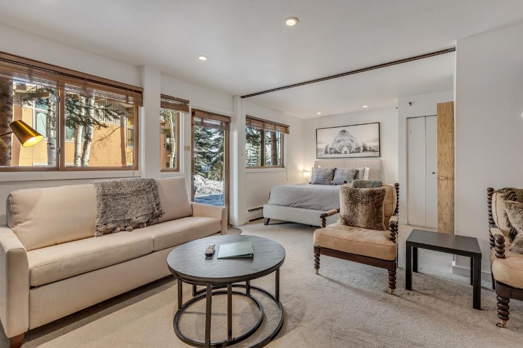 a living room with a couch and a bed at Laurelwood Condominiums 103 in Snowmass Village