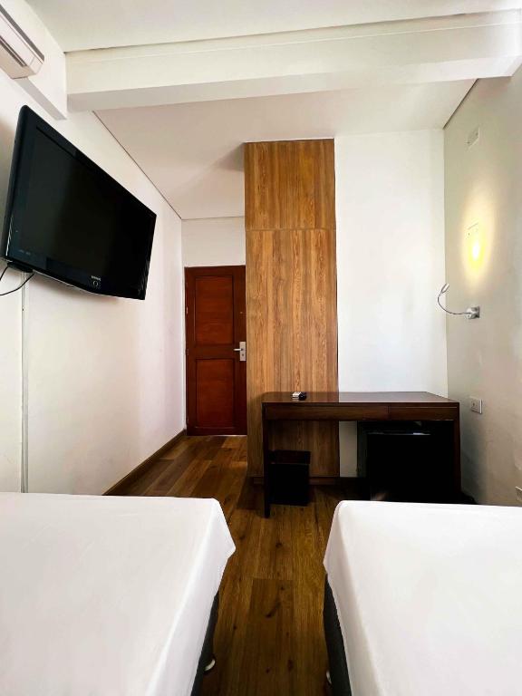 Postel nebo postele na pokoji v ubytování Hotel Florencia Plaza