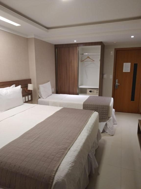 Postel nebo postele na pokoji v ubytování Pituba Praiamar Hotel