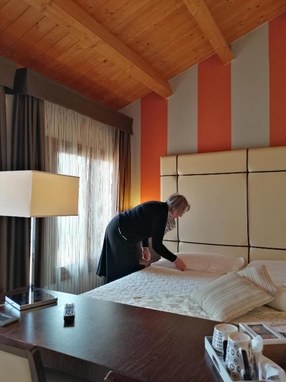 Postel nebo postele na pokoji v ubytování Albergo Minuetto