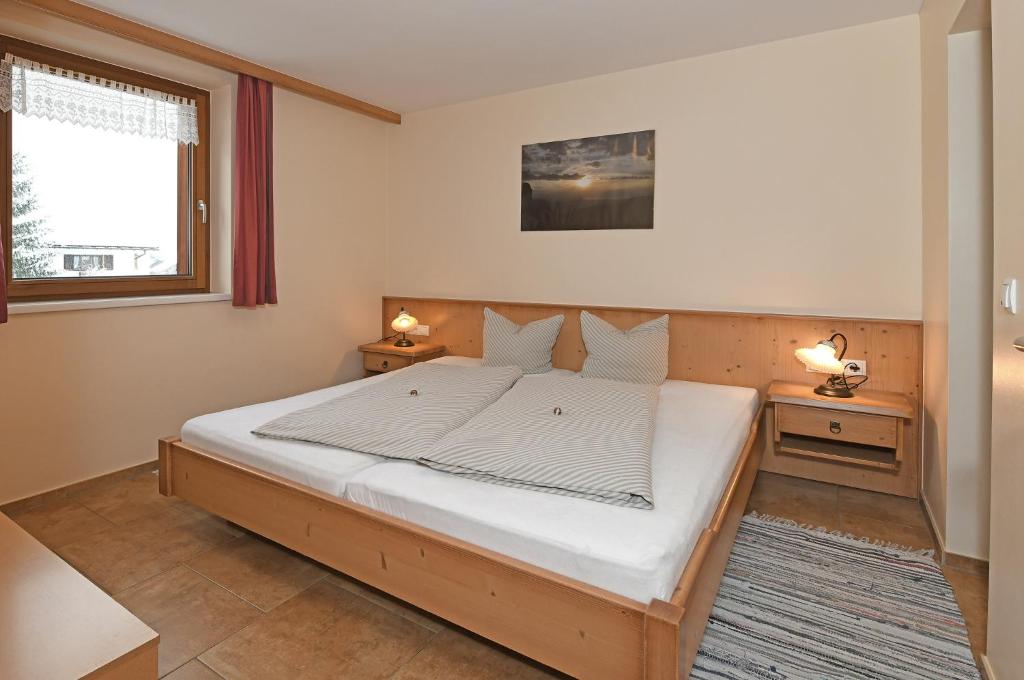 Posteľ alebo postele v izbe v ubytovaní Tre Soli Appartements Restaurant