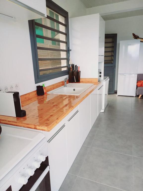 Kuchyň nebo kuchyňský kout v ubytování Le DAMOUR Appartement 1 ou 2 chambres